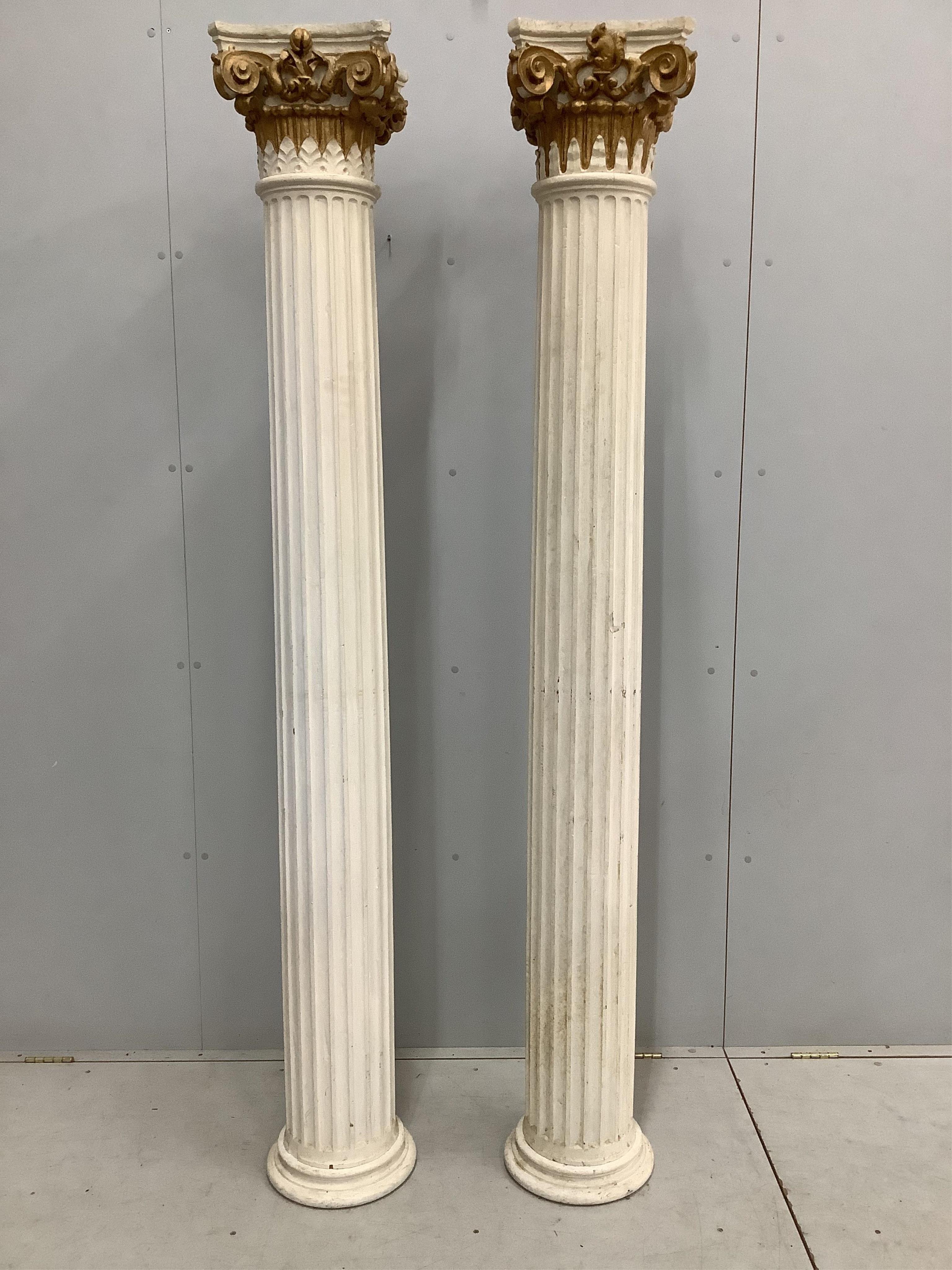 A pair of painted wooden Corinthian columns, height 205cm